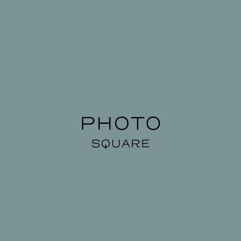 A plain square image with a muted blue-grey background. In the center, the word PHOTO is written in uppercase letters above the word SQUARE in smaller uppercase letters. - Van Wingerden Commercial Greenhouses